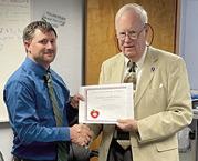 A Challenge Award was presented to Southeast Middle School Principal Nick Hansen by Kansas State Board of Education member Jim Porter. Courtesy photo.