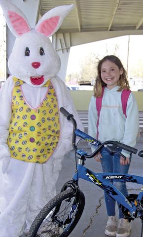 The grand prize winner in the eight to ten age division Jewelie Shrater was presented a new bicycle by the Easter Bunny Saturday morning at the Columbus Chamber of Commerce Easter Egg Hunt.