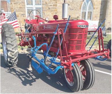 The Farm Heritage Show was held during the Columbus Day Festival. The above tractor, a 1951 Farmall H was entered into the show by Jim Zook. He was awarded “Best in Show”. Zook is pictured below right.