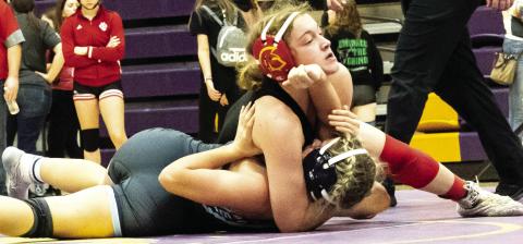 Lady Titan Senior, Addison Saporito, works for one of her four pins in the Kansas Class 4-3-2-1A Regional Championship Tournament, Saturday in Coffeyville. Addison claimed the 120-pound Regional Champion Title and advances to the state tournament, February 22-23, in Salina. Courtesy Photo.