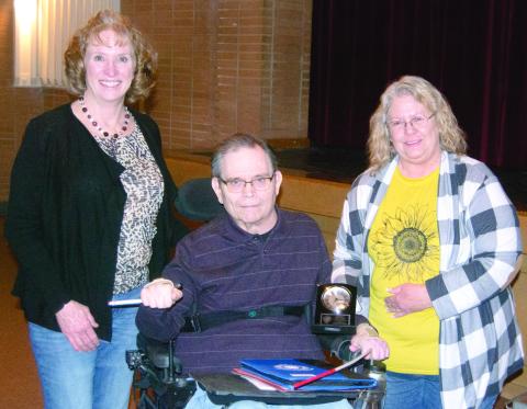 Paul Bone was recognized for his 35 years of service to the Conservation Service at the annual meeting held Monday, February 24 at the Columbus High School Auditorium. The recognition was presented by Wendie Powell County Executive Director of Crawford County and Jodi Cushenbery from Labette County.