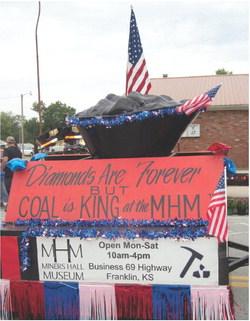 Miners Hall Museum float that appeared in the Weir Homecoming parade. The parade’s theme was “When Coal Was King”. Tilton and Sons’ House moving pulled the museum float. They are the company moving the “one-of-a-kind” Page 618 Dragline to Franklin. The Page 618 Dragline will be the “only” and “largest” walking dragline preserved in the United States.