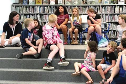 Those attending the Johnston Public Library Tails and Tales program
