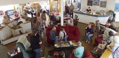 A large crowd turned out for the new art show at Maple Uncommon Sunday. The show features artists from the Joplin Regional Art Coalition and will be on display through July. Photo by Sara Comer.