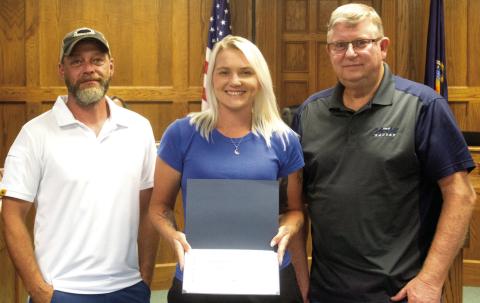 A certificate was presented to Kasie England by City Superintendent Randy Coble and Mayor Grant Spieth recognizing her five years working in the Public Works Department of the City of Columbus. The presentation was made during the City Council meeting on Monday evening.