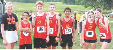 Members of the Columbus Junior High School Cross Country Team display the medals they won at their home meet, Tuesday, at Brush Creek Golf Course. Lydan Atkinson won the eighth boys race and Lyndee Smiley placed fourth in the eighth grade girls race. Carrie Engroff is the coach for the CJHS team. Kross Davis, Lydan Atkinson, Trevor Lacen, Kai Davis, Alaina Smiley, and Lyndee Smiley were present for the photo.