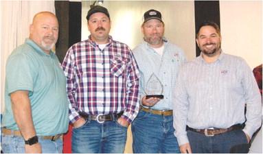 Farmers Coop employees Paul Evans, Jeff Karsten, Trevor Brown and Coop Manager Matt Case accepted the Business Growth Award at the Economic Development Breakfast Wednesday.