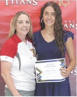 Brylie Johnson received the Callie Henson Memorial Scholarship in the amount of $500 from Ryan Lacen during the 2025 Senior Assembly at the CUHS Gymnasium, May 16.