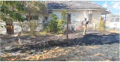 After a grass fire got out of hand due to the extremely hot and dry conditions it caused serious damage to the outside of a residence in Columbus. A burn ban was issued by the City of Columbus Thursday. Photo courtesy of Columbus Fire Department.