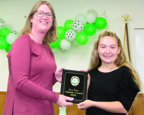 The 4-H award is given to a person that belonged to 4-H as a youth and continues to support 4-H today. That award this year went to Laura Holmes. She has helped at every club activity and encourages all the kids to participate. She is taking new responsibilities as a Club Leader for Spring Valley Sparklers. President Amory Neely presented the