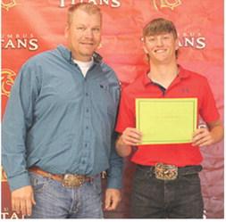 Senior, Cal Saporito, received three ag related scholarships from CUHS Ag Instructor, KC Youngblood during the Senior Assembly, May 15 at the Columbus High School Gym. The Raymond Mitchell Memorial, The Willy Benedict Memorial, and the FFA Alumni Scholarships were awarded as $500 per scholarship.