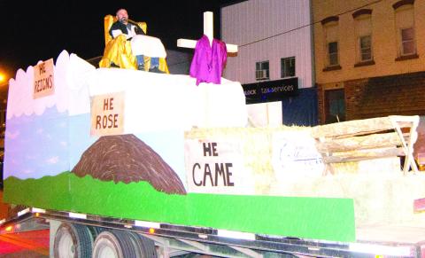 At the annual Columbus Christmas parade the crowd looks forward to the floats. Center Christian Church created this float.