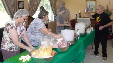 Employees of Medicalodges were busy making salads on Wednesday morning as a fund raiser. The money will be used to take residents on a field trip. In the past they have gone to several shows in Branson