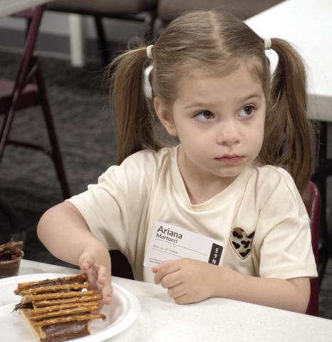 Connecting Point Church of the Nazarene recently held their first Vacation Bible School, ‘Rainforest Falls’. The theme focus for Wednesday, July 29 was “God is our safe place.” Ariana Martocci builds a cabin of graham crackers, pretzels and Nutella.