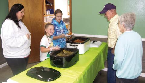Members of the Cherokee County 4-H Clubs held a spaghetti lunch to raise funds for improvements to their local building. The youth helped prepare and serve the lunch to area diners. Keith and Helen Kelly were among the diners supporting area youth.