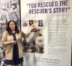 Megan Stewart Felt, program Director of the Lowell Milken Center for Unsung Heroes in Fort Scott shows the Sheridan Homemakers a panel from the Irena Sendler exhibit. Felt was one of three Uniontown students who discovered Sendler’s story. Photo courtesy of Evon Goettel.
