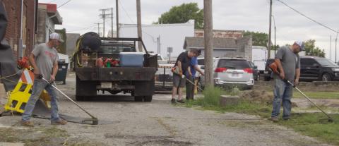 City employees were busy as part of the Imagine Columbus Service Day. The City joined in by cleaning and weeding alleys and parking lots in the city.