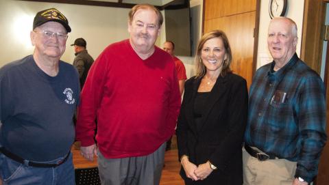 Two long time fire fighters (left) Wayne Cook and Les Page surround Tim Shallenbuger and City Treasurer DeeAnn Auman-Hill. Shallenburger and Hill worked tirelessly on procuring the funding for the new building.