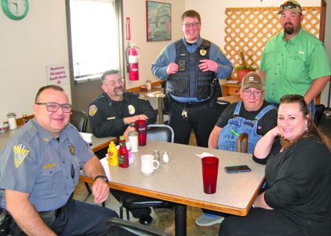 Cherokee County Sheriff Brian Henderson, Baxter Springs Police Chief Jimmy Hamilton, Assistant Baxter Springs Police Chief Corky Hicks and Community Outreach Deputy Rhanda Andrews visit with locals at a recent “Coffee With a Cop” event.