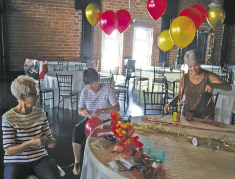 A lot of work goes into putting on the All-School Reunion. Before the dinner began, committee members showed up to inflate balloons, tie on ribbons and decorate all the tables and make sure everything was ready for the evening’s festivities.