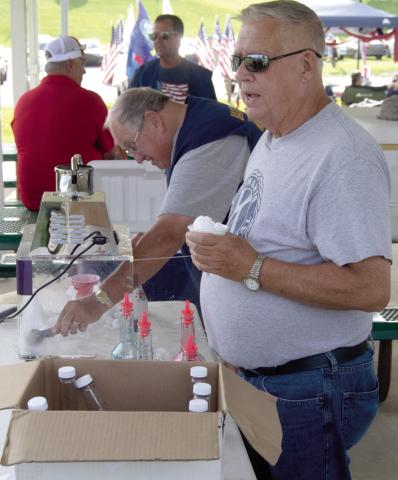 The Baxter Springs Kiwanis Club members were busy handing out snow cones and cotton candy to the crowd at “Light up the Sky” event Saturday evening before the fireworks at Kiwanis Park. Casey Roberts and Jim Day were busy serving the treats.