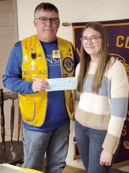 Lions Club President Mark Winter presented Lion of the Month Kennedy Bullard with a Chamber of Commerce gift certificate at a recent meeting.
