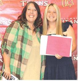 Senior Morgan Richards received the $150 Difference Maker Scholarship from Kerri Matson during the Columbus Unified High School Senior Assembly, in the CUHS Gymnasium, May 15.