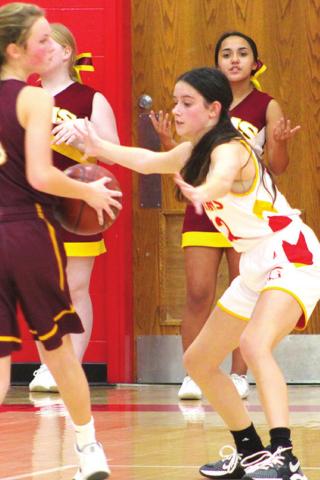 Lady Titan Eighth Grader, Piper Hayes, defends her Girard opponent during the 8A game at the Central Junior High Gym, Monday. The Lady Trojans took a 41-18 win over the hometown Lady Titans.