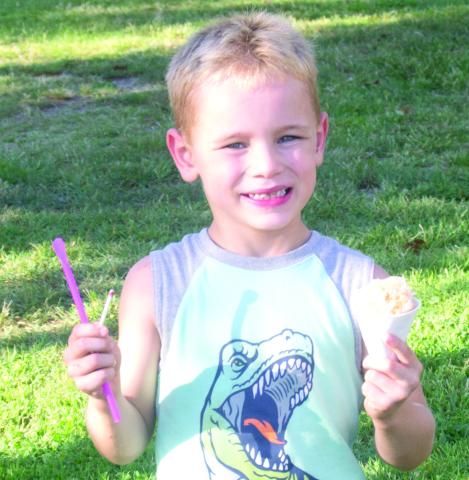 The Elementary Back to School Carnival held in the Columbus City Park came with great weather and a good turnout. Tyson Loraine Capron has his hands full of goodies as he heads for the next booth.