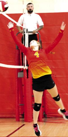Bentley Townsend tips the ball over the net in the Columbus Eighth Grade Lady Titan win over Baxter Springs, Saturday, in the Columbus Eighth Grade Tournament hosted at the Columbus High School Gymnasium. The Lady Titans had a 25-17 set win over the Lady Lions in pool play and lost the first set, 16-25.