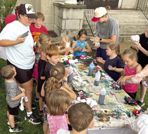 A bit of rain did not dampen the enthusiasm or spoil the fun for the youngsters at the library recently. Given white t-shirts, gloves and some dye children were encouraged to create a wearable masterpiece. A large number of youngsters showed up for the tie dye shirt event.