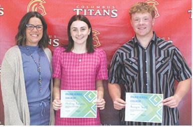 Mallory Thompson and Kanyen Smith received the Boulware Family Scholarship in the amount of $1,050 each from USD 493 Instructor, Kelly Walters during the 2025 Senior Assembly, May 16, at the Columbus Unified High School Gymnasium.
