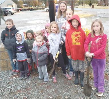 The planter box at the Cherokee County Extension Office recently had some new flowers installed. The Heritage Youth of America, a newly formed youth development group planted mums. Those helping included Isaac Zahm, Sawyer Gregory, Jessee King, Ellie Gregory, Eli Zahm, Jael King, Elizebeth King, Katherine King, Lucy Zahm, Samuel King and Adalynn Garner. Courtesy photo.