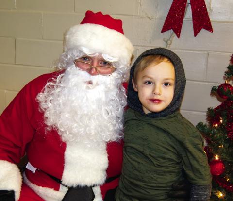 Maverick Wise was talking with Santa Sunday following the Scammon Christmas Parade. The traditional cookie and hot chocolate treats for the kiddies and visit with the jolly elf from the North Pole.(Right)