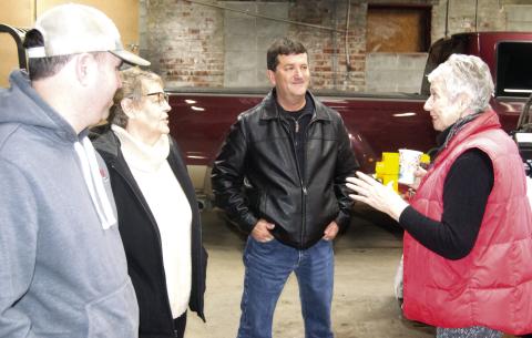 Hammer Tires and Service employee Mike Bartling visits with Chamber of Commerce Director Jean Pritchett and Cherokee County Economic Development Director David Stricklin, and Chamber of Commerce president Laura Lowry Greene talk about business practices.