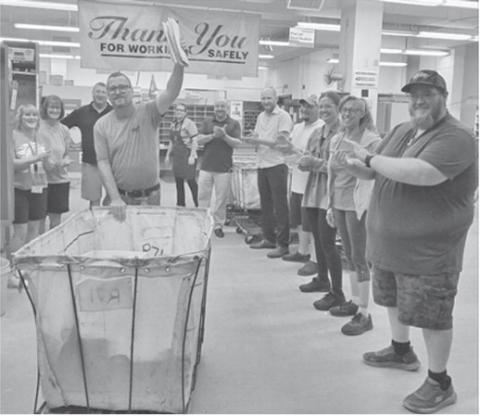 Pat York participates in the traditional “running of the gauntlet” at the Columbus Post Office. York is retiring after 26 years of service. Co-workers lined up to congratulate York on his accomplishments and to wish him well in his future endeavors. Courtesy photo.