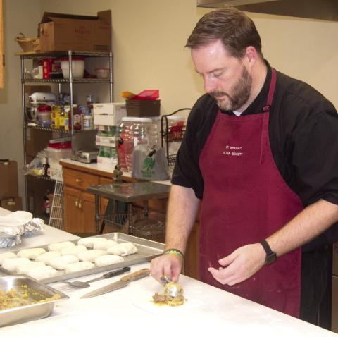 St. Bridget’s Catholic Church held their annual Oktoberfest dinner on Sunday with a special treat from Father Chris Martin as he prepared the bierocks filling using his grandmother’s recipe.