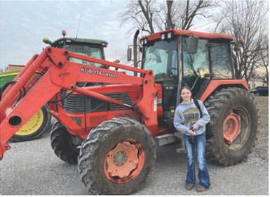 Grace Eshelman was one of the Columbus High School Future Farmers of America members who drove her tractor to school as part of FFA Week at CUHS. Due to the weather, the breakfast they had scheduled has been reset to Wednesday, February 26 from 7 a.m.-9 a.m. in the Ag room. Courtesy photo.