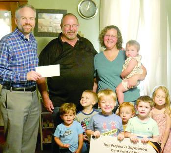 Candice Anderson’s Little Blessing Day Care in Baxter Springs, received a grant from Community Foundation of Southeast Kansas (CFSEK) for outdoor toys, storage and nap mats. Devon Gorman with CFSEK presented the check.