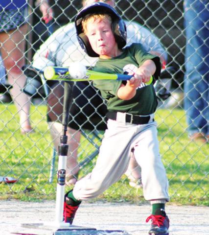Baylor Bowman makes good contact for a big hit in Columbus Cal Ripken T-Ball action at the Community Field Ball Park.