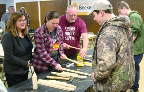 Everyone was busy as bees during the Cherokee County area Beekeepers club meeting as they were building frames to put in the hive box which was given away.