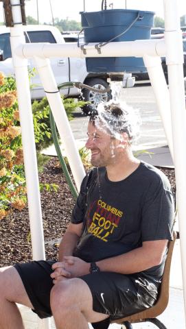 One of many games for students to participate in at the annual Back-To-School Carnival hosted by Columbus USD 493 Thursday, August 27 was the ‘Dunk Tank’ sponsored by Coffeyville Community College. Park Elementary Principal Matthew Crain was all smiles just before this torrent of water cascaded onto his head.