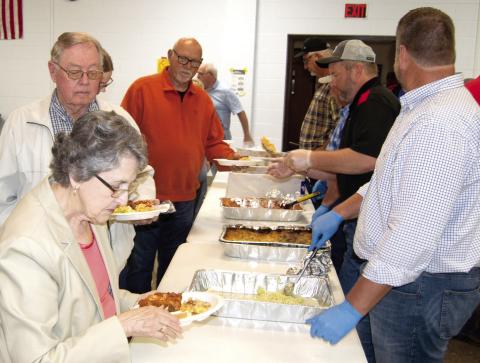 Farmers Coop board members served members a chicken dinner on Friday evening