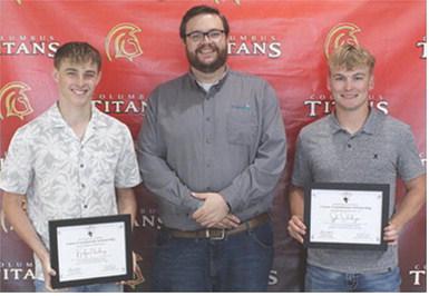 Korbyn Newberry and Syler Schuberger were the recipients of the Heartland Scholarships in the amount of $1,000 each from Heartland Representative, Doug Graham at the Senior Assembly, May 16, in the CUHS Gymnasium.