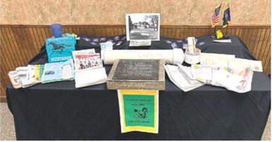 Students who attended Greenlawn Elementary School 25 years ago were able to view the items they placed into a time capsule. The capsule was recently dug up and was opened up Wednesday night at the Cherokee County Fair. The items are currently on display in the board office.
