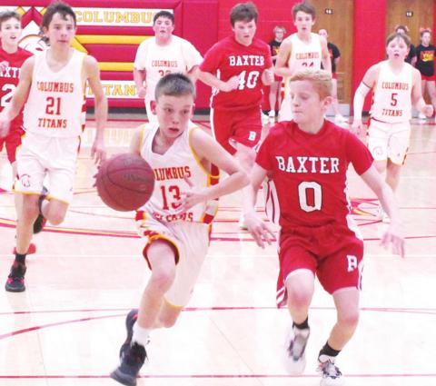 Titan Seventh Grader, Carter Woodcock, gets a break-away drive during the Central Titan 7A loss to Baxter Springs, January 6 at the Central Gym. Logan Abbott defends for the Lions. Drake Laurance, Brody Matson, Kooper Saiz, and Ethan Midgett trail for the Titans. Brooks Walker is in the mix for the Lions.