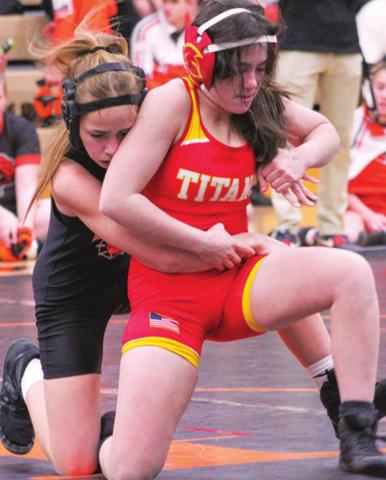 Grace Noel escapes her Independence opponent to win by pin over Riley Salisbury, January 25, at Independence.