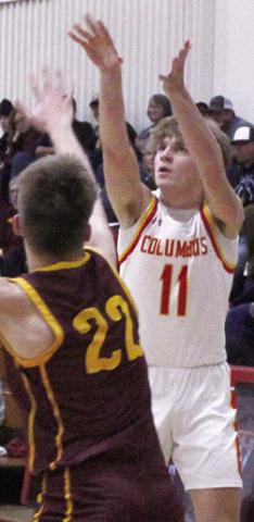 Titan Senior, Mack Kirk, shoots over Girard Senior, Tommy McDowell, in the 49-37, Titan win over the Trojans, Tuesday, in Columbus.