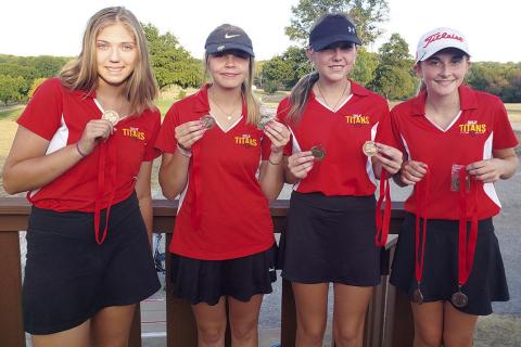 The Columbus Lady Titan Golf Team completed their 2022 regular season at the Baxter Springs CNC Invitational Tournament, Tuesday, at the Baxter Springs Country Club Golf Course. The Lady Titan Team placed third in team standings and sophomore, Mallory Thompson, taking fifth in individual placings. Displaying their hardware are: sophomore, Anna Head, senior, Kenlyn Christiansen, junior, Reese Grundy, and Thompson. Courtesy Photo.