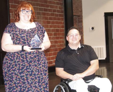 Gracefully Managed LLC owner Sara Comer accepted the Cherokee County Economic Development Corporation’s Business Growth award from board chairman Brian Smith at the organization’s annual breakfast meeting.